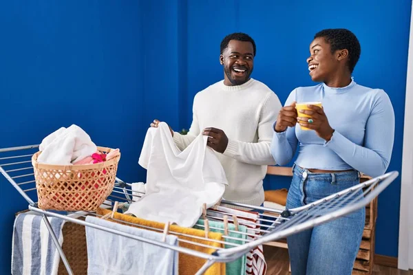 Man Woman Couple Drinking Coffee Hanging Clothes Clothesline Laundry Room — Stock Photo, Image