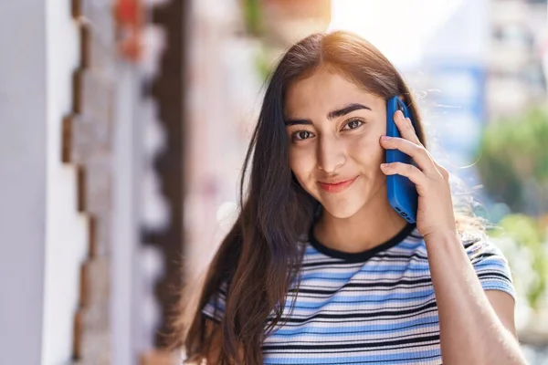 Young Hispanic Girl Smiling Confident Talking Smartphone Street — Stockfoto