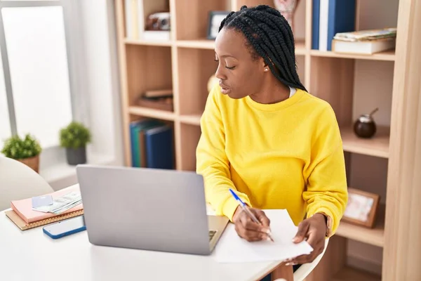 African American Woman Using Laptop Writing Document Home — Stockfoto