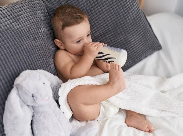 Adorable Caucasian Baby Sucking Milk Feeding Bottle Sitting Sofa Home — Stock Photo, Image