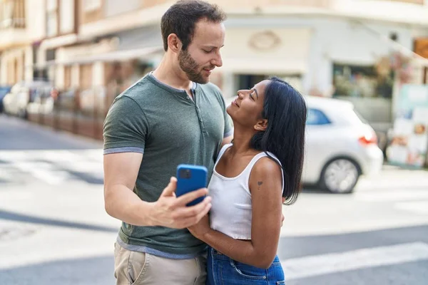 Man Woman Interracial Couple Hugging Each Other Using Smartphone Street — Photo