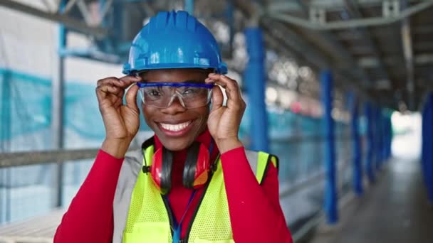 African American Woman Architect Smiling Confident Taking Out Protection Glasses — Stock Video