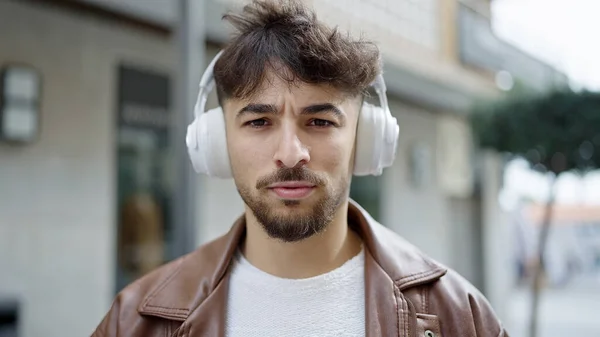 Young Arab Man Listening Music Relaxed Expression Street — 스톡 사진