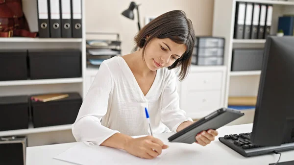 Young Beautiful Hispanic Woman Business Worker Using Touchpad Writing Document — Zdjęcie stockowe