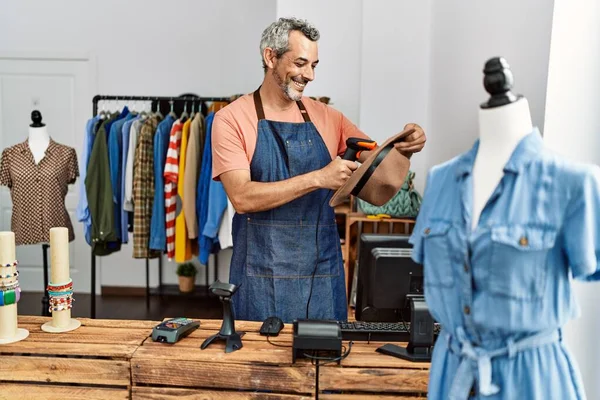 Middle Age Grey Haired Man Shop Assistant Scanning Hat Clothing — Stockfoto