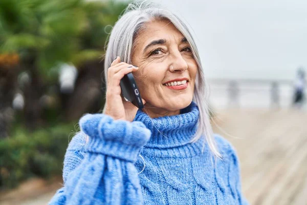 Middle Age Grey Haired Woman Smiling Confident Talking Smartphone Seaside —  Fotos de Stock