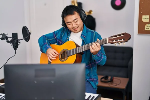 Young Chinese Man Guitarist Playing Classical Guitar Music Studio — Fotografia de Stock