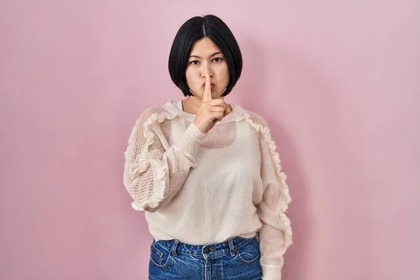Young Asian Woman Standing Pink Background Asking Quiet Finger Lips — Stockfoto