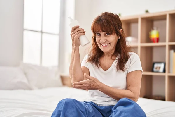 Middle Age Woman Having Moisturizer Treatment Sitting Bed Bedroom —  Fotos de Stock