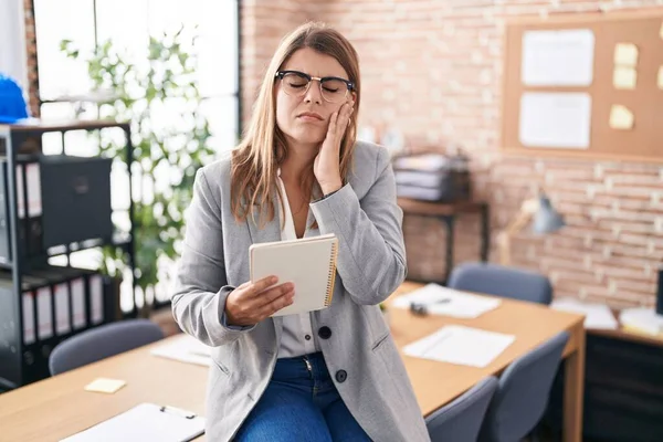 Young Hispanic Woman Working Office Wearing Glasses Touching Mouth Hand — Stock fotografie