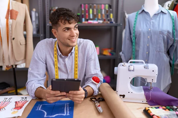 Young Hispanic Man Tailor Smiling Confident Using Touchpad Atelier — Stock Fotó