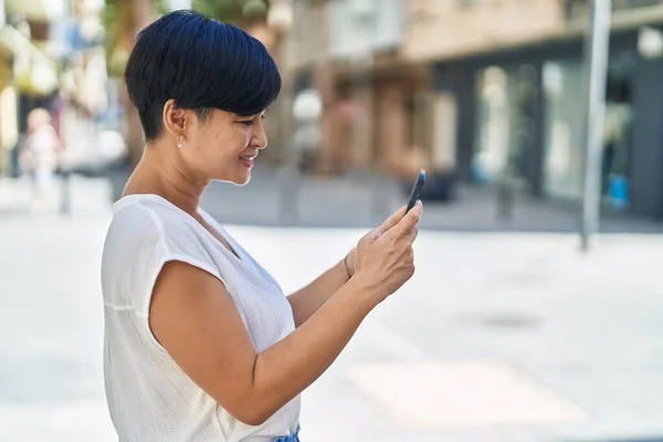 Middle Age Chinese Woman Smiling Confident Using Smartphone Street — Stockfoto