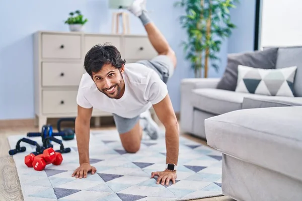 Young Hispanic Man Smiling Confident Stretching Home — Foto Stock