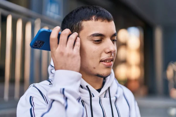 Young Man Smiling Confident Listening Audio Message Smartphone Street — Foto de Stock