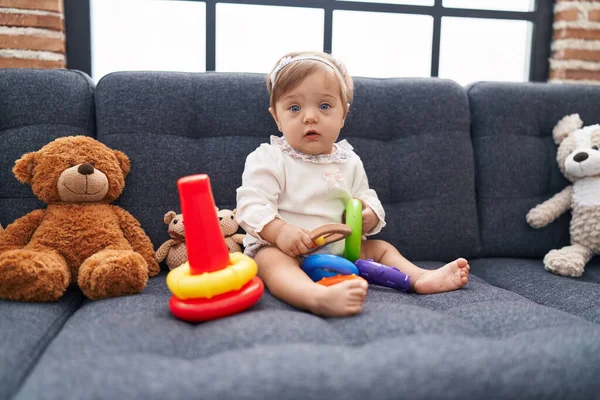 Adorable Caucasian Baby Playing Hoops Game Sitting Sofa Home — Stock Photo, Image