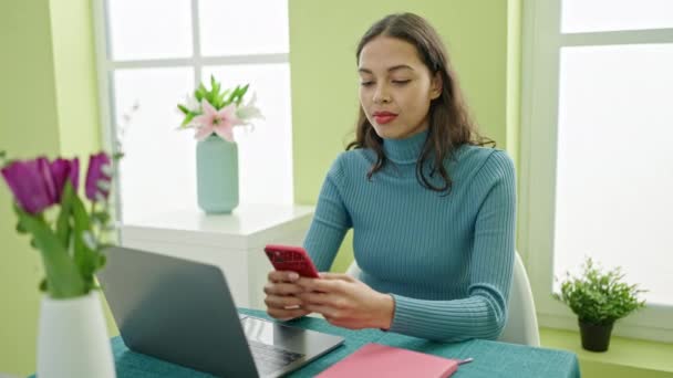 Young Beautiful Hispanic Woman Using Smartphone Laptop Sitting Table Home — Stock Video
