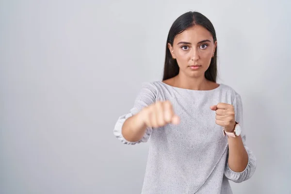 Young Hispanic Woman Standing White Background Punching Fist Fight Aggressive — Photo