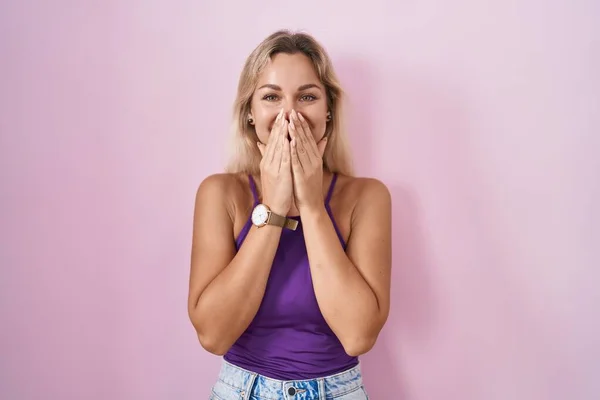 Young Blonde Woman Standing Pink Background Laughing Embarrassed Giggle Covering — Foto Stock