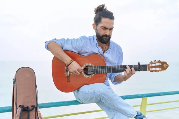 Young Hispanic Man Musician Playing Classical Guitar Sitting Balustrade Seaside — Stock Fotó