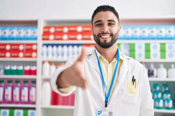 Young Arab Man Pharmacist Smiling Confident Shake Hand Pharmacy — Foto de Stock