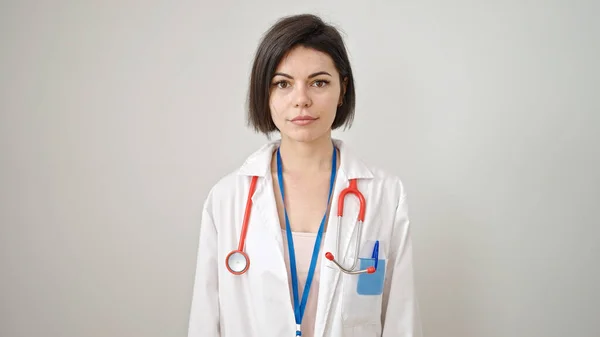 stock image Young caucasian woman doctor standing with serious expression over isolated white background