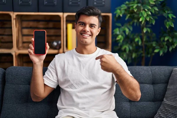 Hispanic Man Holding Smartphone Showing Blank Screen Pointing Finger One — Stock Photo, Image