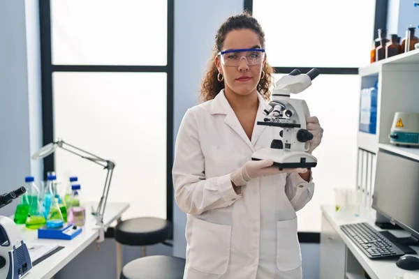 Young Hispanic Woman Working Scientist Laboratory Skeptic Nervous Frowning Upset — Stock Photo, Image