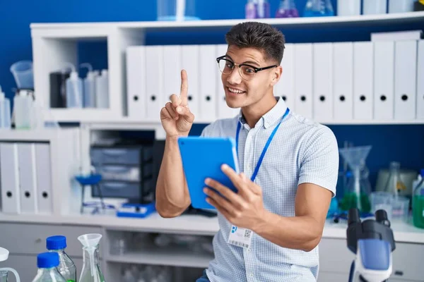 Young Hispanic Man Working Scientist Laboratory Doing Video Call Smiling — Stock fotografie