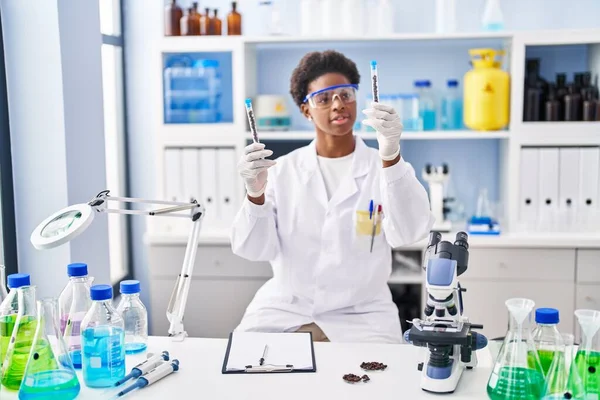 African American Woman Wearing Scientist Uniform Holding Test Tubes Laboratory — ストック写真