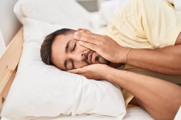 Young Hispanic Man Stressed Lying Bed Bedroom — Zdjęcie stockowe
