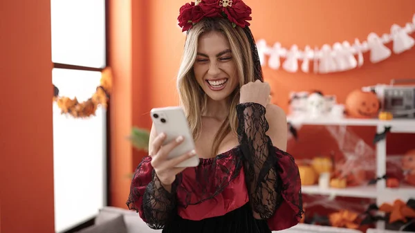 Young Blonde Woman Using Smartphone Having Halloween Party Home — Foto de Stock