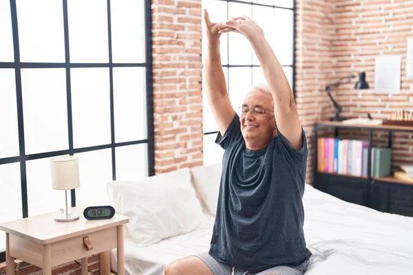 Middle Age Grey Haired Man Waking Stretching Arms Bedroom — стоковое фото