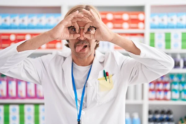 Caucasian Man Mustache Working Pharmacy Drugstore Doing Gesture Binoculars Sticking — Stock Photo, Image