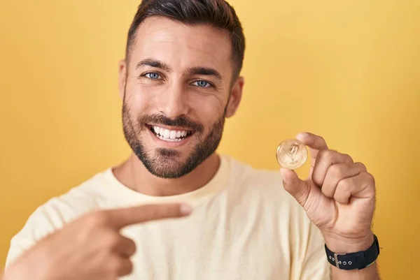 Handsome Hispanic Man Holding Tron Cryptocurrency Coin Smiling Happy Pointing — Foto de Stock
