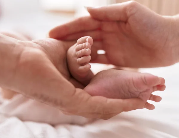 Adorable Caucasian Baby Lying Bed Having Feet Massage Bedroom — Stok fotoğraf