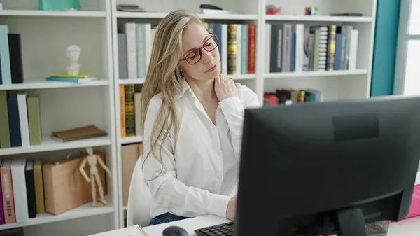Young Blonde Woman Student Stressed Using Computer Sitting Table Library — Foto de Stock
