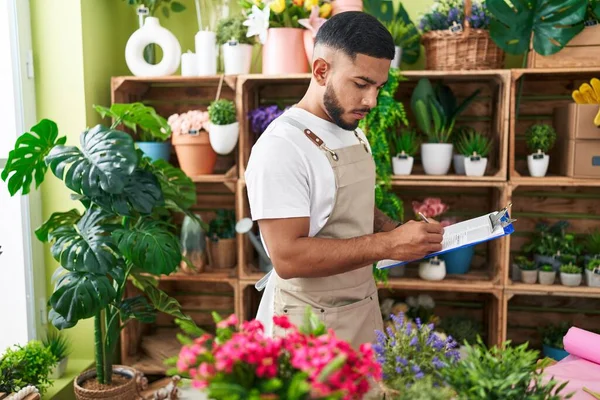 Young Latin Man Florist Writing Document Flower Shop — Stock Photo, Image