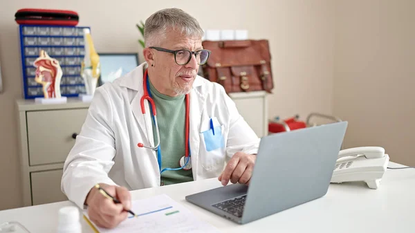 Middle Age Grey Haired Man Doctor Using Laptop Working Clinic — Stock Photo, Image
