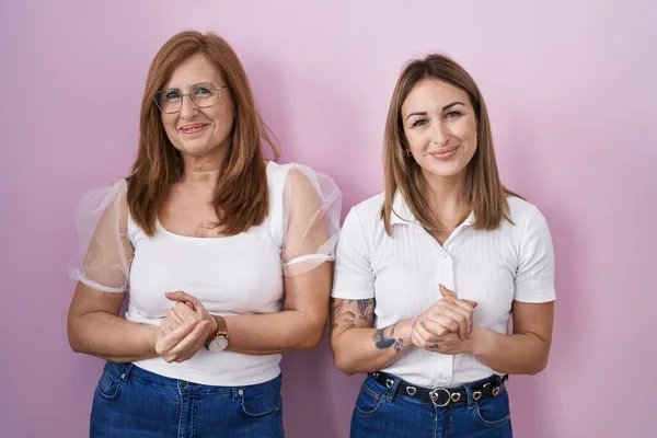 Hispanic Mother Daughter Wearing Casual White Shirt Pink Background Hands — Stock Photo, Image