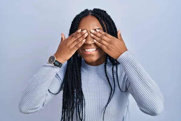 African American Woman Standing Blue Background Covering Eyes Hands Smiling — Stock Photo, Image