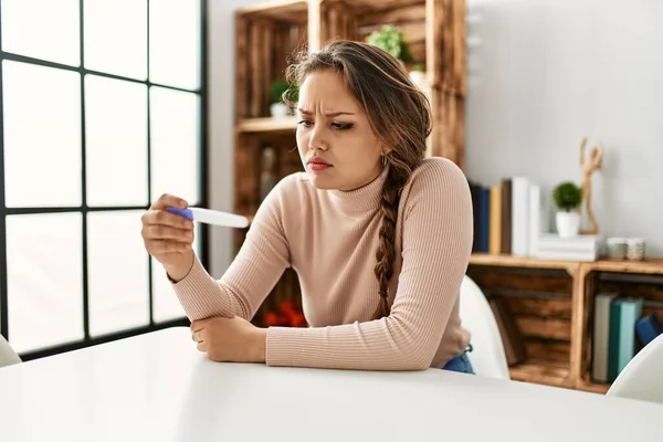 Young Beautiful Hispanic Woman Holding Pregnancy Test Sitting Table Home — Stock Photo, Image