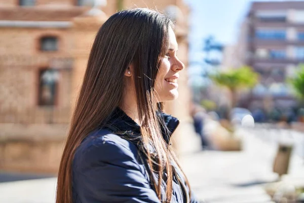 Stock image Young beautiful hispanic woman smiling confident looking to the side at street