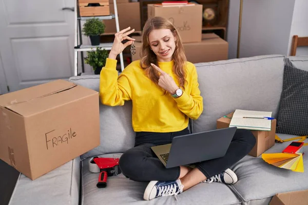 Young Blonde Woman Having Video Call Holding Key New Home — Stockfoto