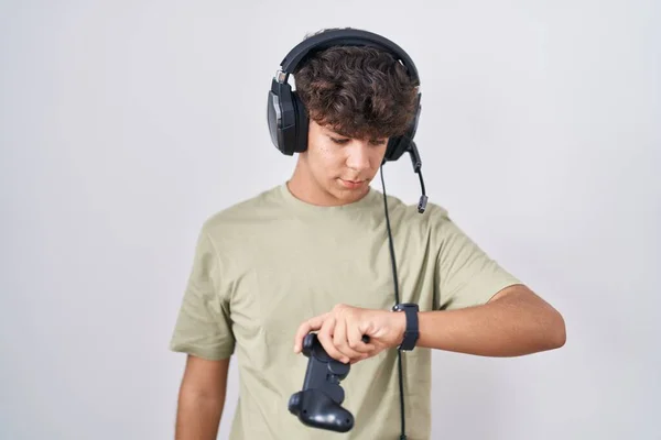 Hispanic Teenager Playing Video Game Holding Controller Checking Time Wrist — Stock Photo, Image