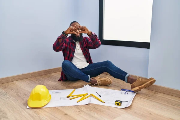 African American Man Sitting Floor New Home Looking Blueprints Smiling — Stock Photo, Image