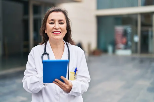 Middle Age Woman Wearing Doctor Uniform Using Smartphone Street — Stok fotoğraf