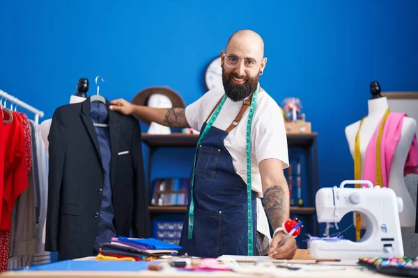 Young Bald Man Tailor Smiling Confident Holding Jacket Writing Notebook — Fotografia de Stock