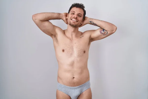Jovem Hispânico Sem Camisa Vestindo Underware Relaxante Alongamento Braços Mãos — Fotografia de Stock