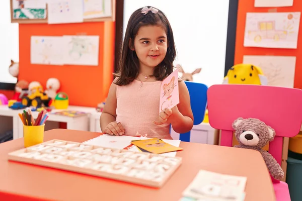 Adorable Hispanic Girl Playing Vocabulary Puzzle Game Sitting Table Kindergarten — Stock Photo, Image