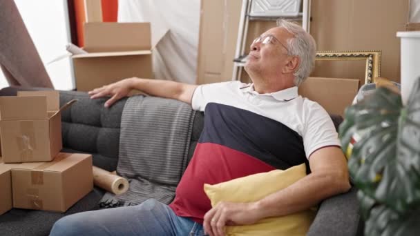 Middle Age Man Grey Hair Resting Sitting Sofa New Home — Stock Video
